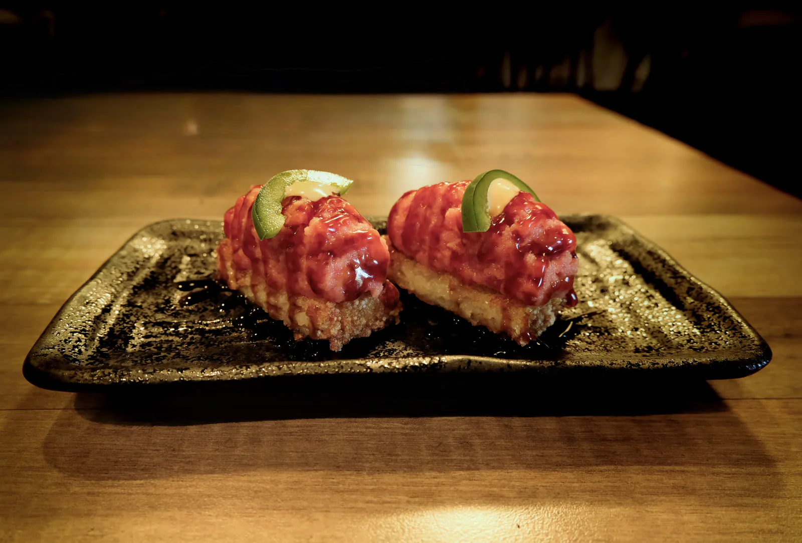 Crispy rice tuna topped with jalapeño
