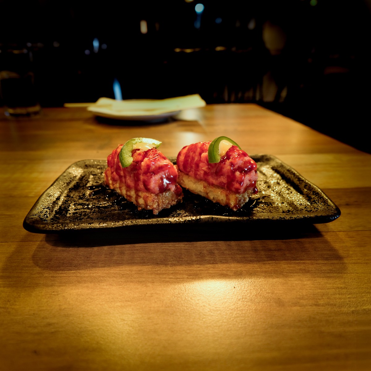 Crispy rice tuna topped with jalapeño