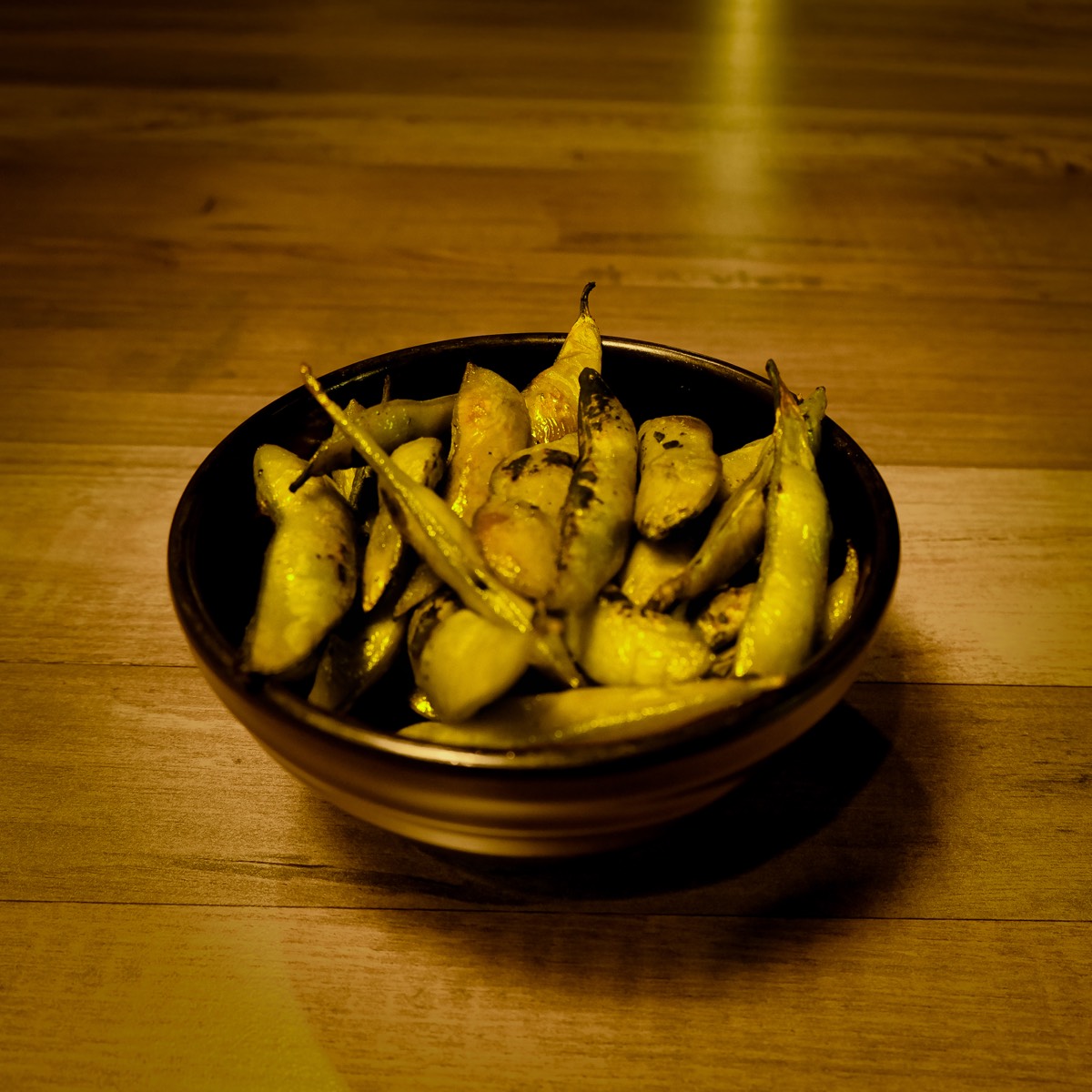 A bowl of toasted edamame
